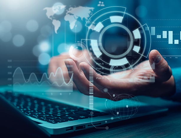 Hand above a laptop with connected charts, a global map and a circular digital interface