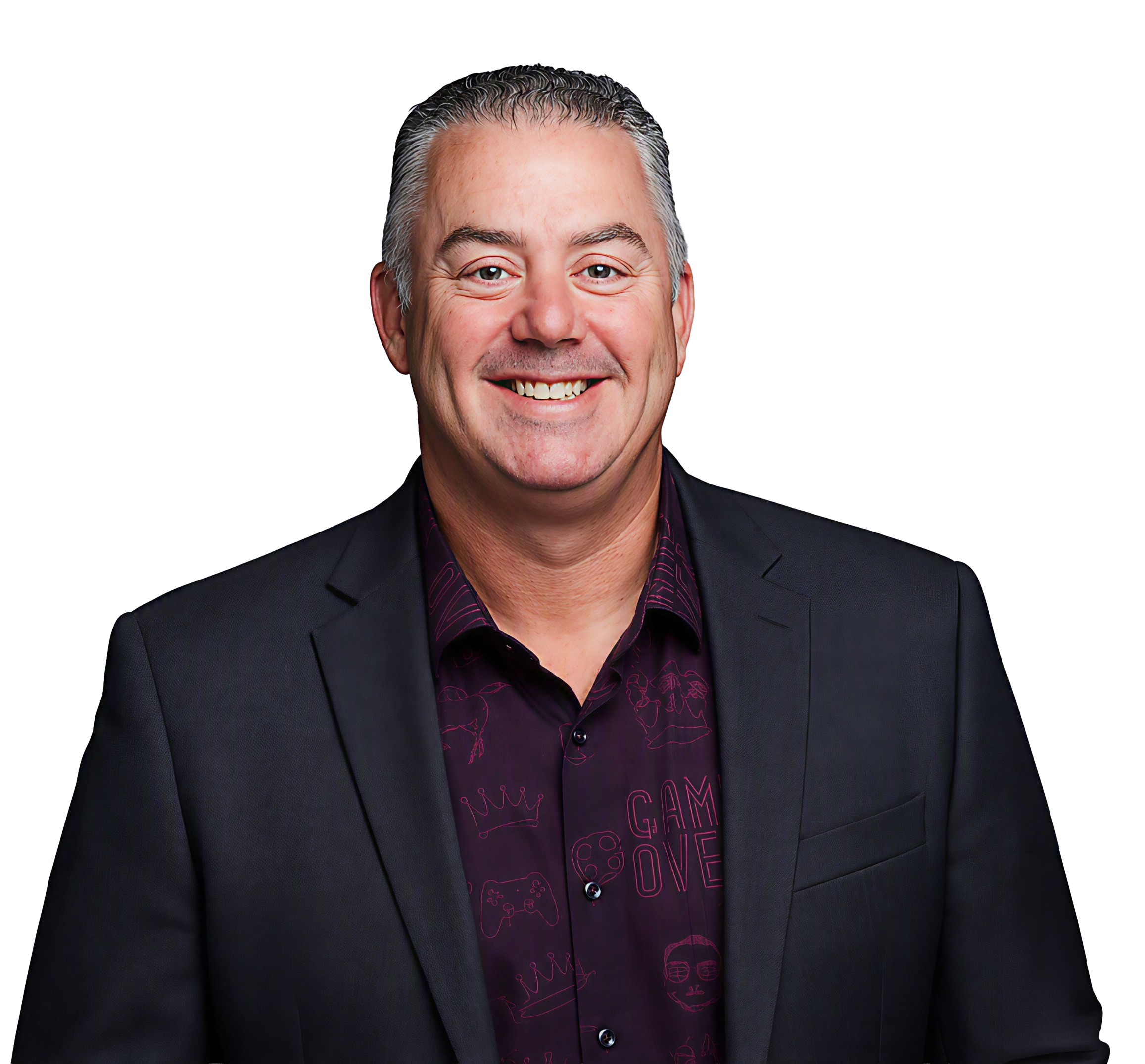 David Leveille, smiling, in a dark jacket over a patterned shirt.