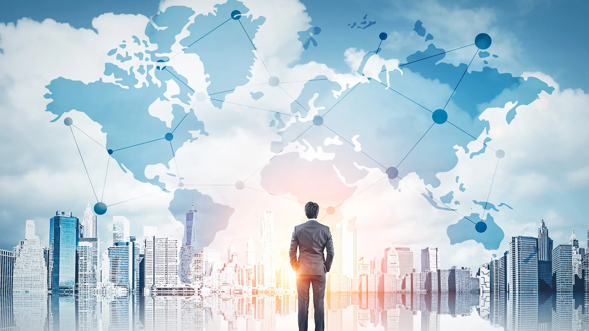 A man stands in front of a city skyline, gazing at a sky mural featuring a world map with interconnected nodes and lines.